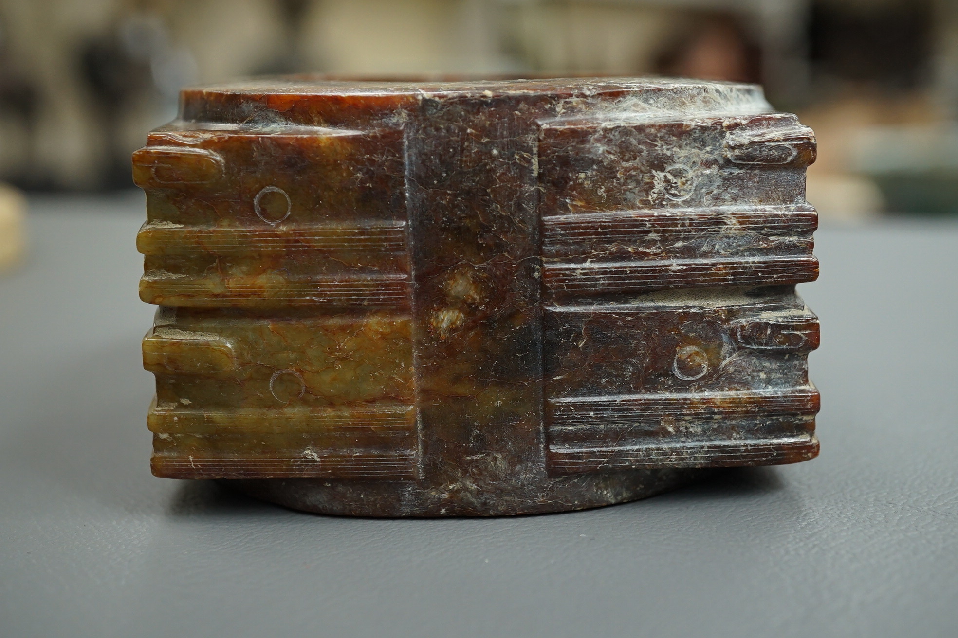 Four Chinese archaistic hardstone or burnt jade cong or cylinders